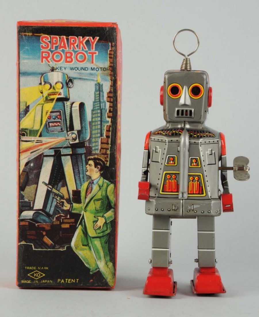 Japanese Tin Litho Sparky Robot.: In original box. Wind - up. Made in Japan by Yoshiya. Comes in rare "detective" variation box. Box has beautiful graphics of man fighting mocking robot. Some minor creasing to top edge of box and bott