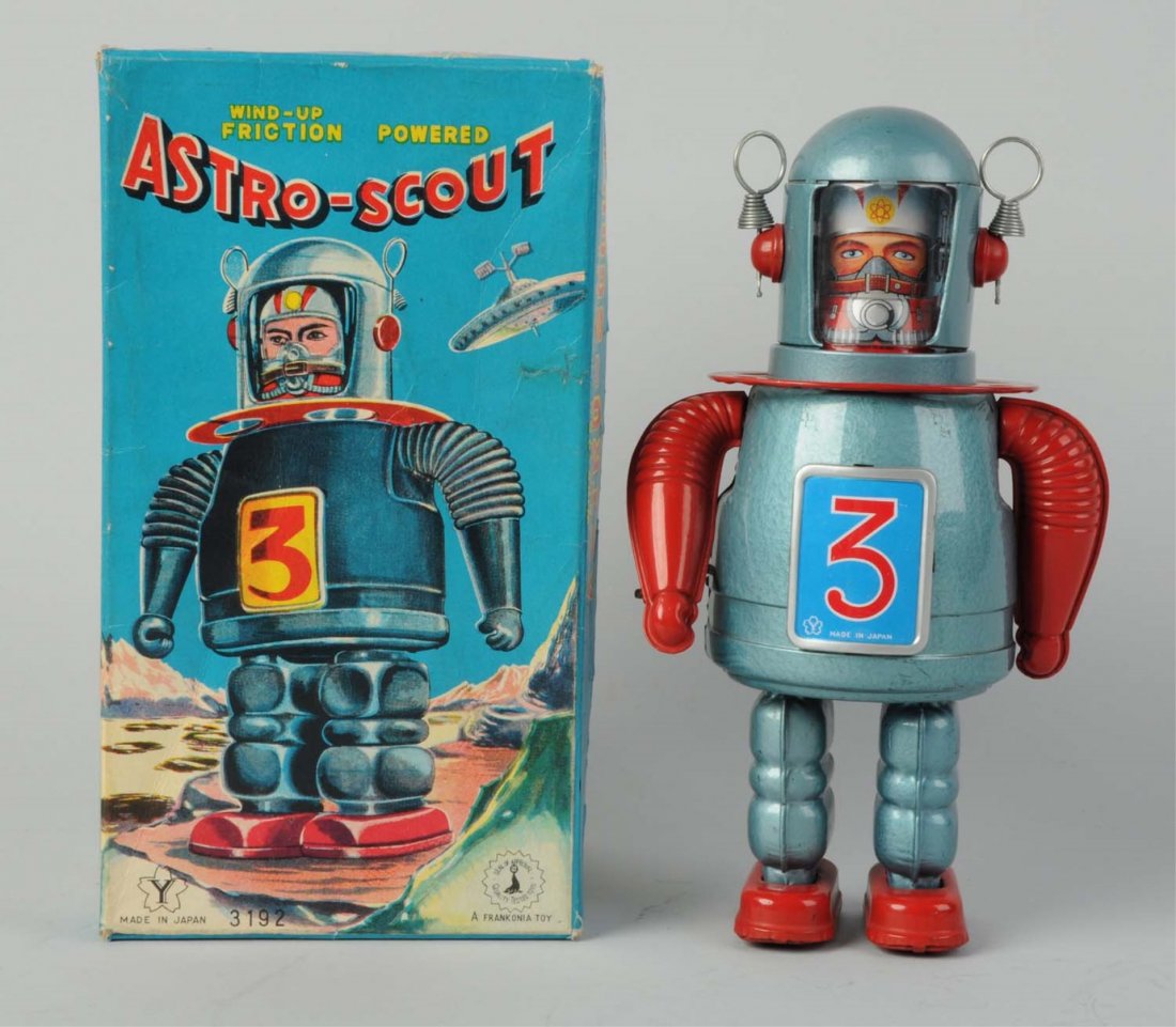 Japanese Tin Litho Astro - Scout Robot.: In original box. Made in Japan by Yonezawa. Crank - wind friction. Box has some general creasing throughout. Robot is bright and shiny, face shield is clear. Some minor scratching to back of head. Toy