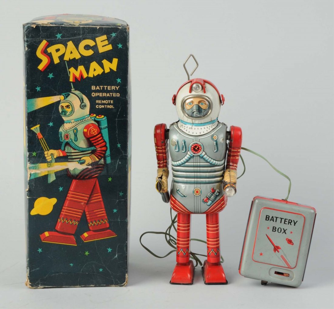 Japanese Tin Litho Space Man Robot.: Battery - operated. In original box. Made in Japan by Nomura. Box lid has inside brown paper reinforcement. Some general creasing throughout box. One one by one inch litho loss on one side panel of bo