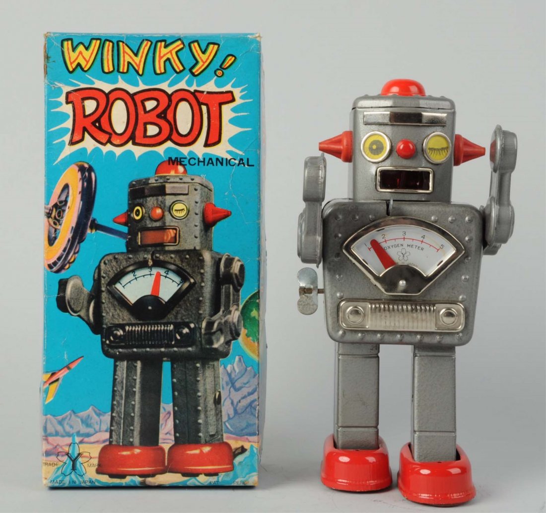 Japanese Tin Litho Wind-Up Winky Robot.: In original box. Box has some creasing and wear. Made by Yonezawa. Working but needs flint to spark. Some scratching to robots legs, some creasing to box. This is the gray litho version. Condition (Ve