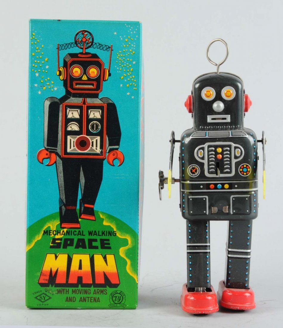 Japanese Tin Litho Space Man Robot.: In original box. Wind - Up. Made in Japan by Yoneya. Very nice colorful box with minimal wear. Robot also with minimal wear, plastic hands look perfect. Fine example. Condition (Near Mint). Size 8 -1/