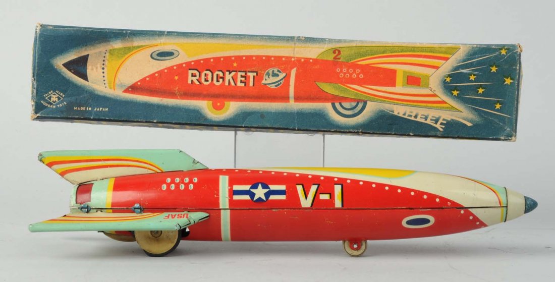 Japanese Tin Litho Sparkling Rocket V-1.: In original box. Friction. Box has very colorful graphics, marked "Made in Japan". Some creasing to end flaps, nice color, depiction of rocket on box. Toy itself has original rubber nose cone. frictio