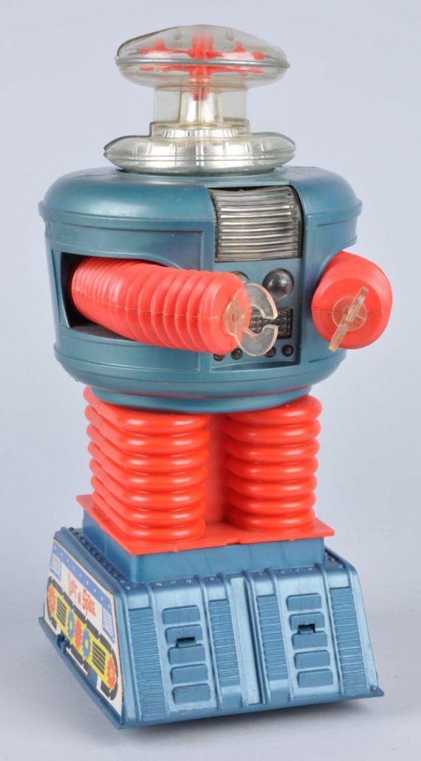 Remco Battery-Operated Lost In Space Robot.: Made of plastic. Complete, including battery bar. Has cardboard inserts on both sides that read "Lost In Space". Top slightly warped, as per usual with this toy. Original hands. Marked "1966 Lost In S