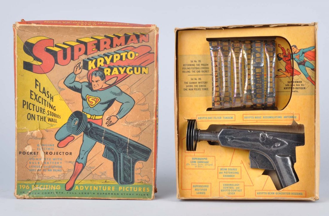 Superman Krypto-Raygun.: Includes colorful original box with insert. Box does have some creasing and tearing. Made by Daisy. Includes film and metal embossed ray gun with Superman on one side. Marked "Superman Krypto-Raygun" 