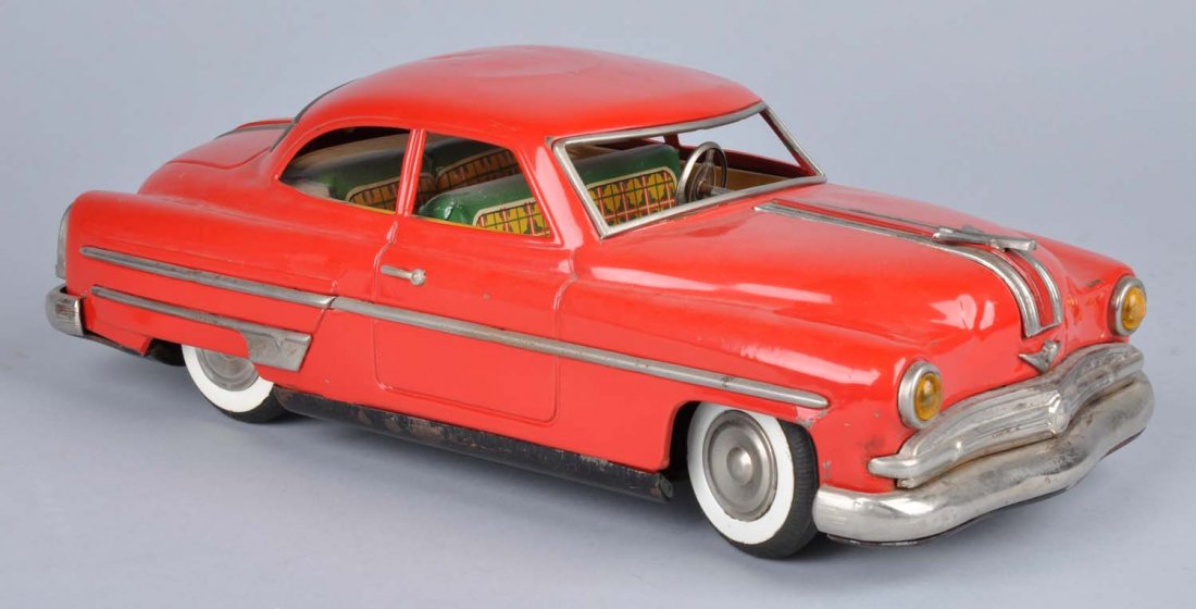 Japanese Tin Litho Friction Automobile.: Fat version. Chevy ornament on front, which is original. Car has oxidation to chrome. Some scratching, denting, and wear. Condition (Very Good). Size 14" L.