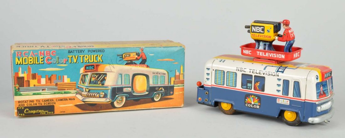 Japanese Tin Litho Mobile Color T.V. Truck.: Battery-operated. Beautiful color box with cardboard insert and marked "RCA-NBC" and "Cragstan". Has original detachable cameraman with camera. Some creasing box. Minor wear to item. Condition (Excell
