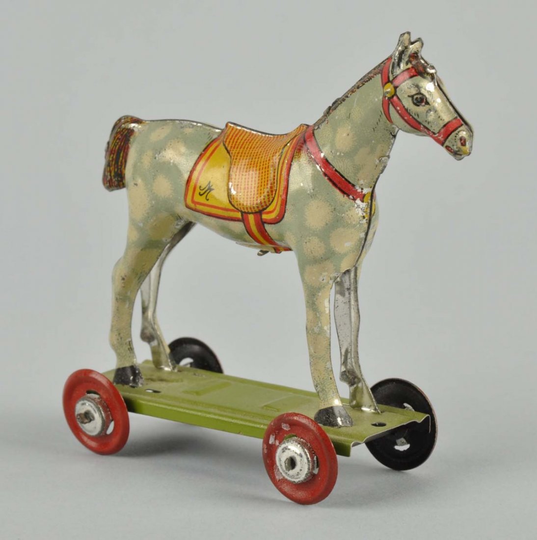 German Tin Litho Platform Horse Penny Toy.: Marked "Gesch" on bottom of horse. Nice colors and lithography. Minor wear. Condition (Very Good - Excellent). Size 3" L.