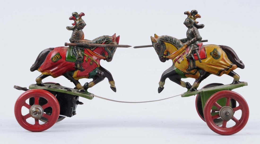 Scarce German Tin Litho Knight Fighting Toy.: This wind - up toy has beautiful litho, two knights on horseback in armor, look like they're jousting. All original except for jousting poles have been replaced. Could clean to a better grade. Conditi
