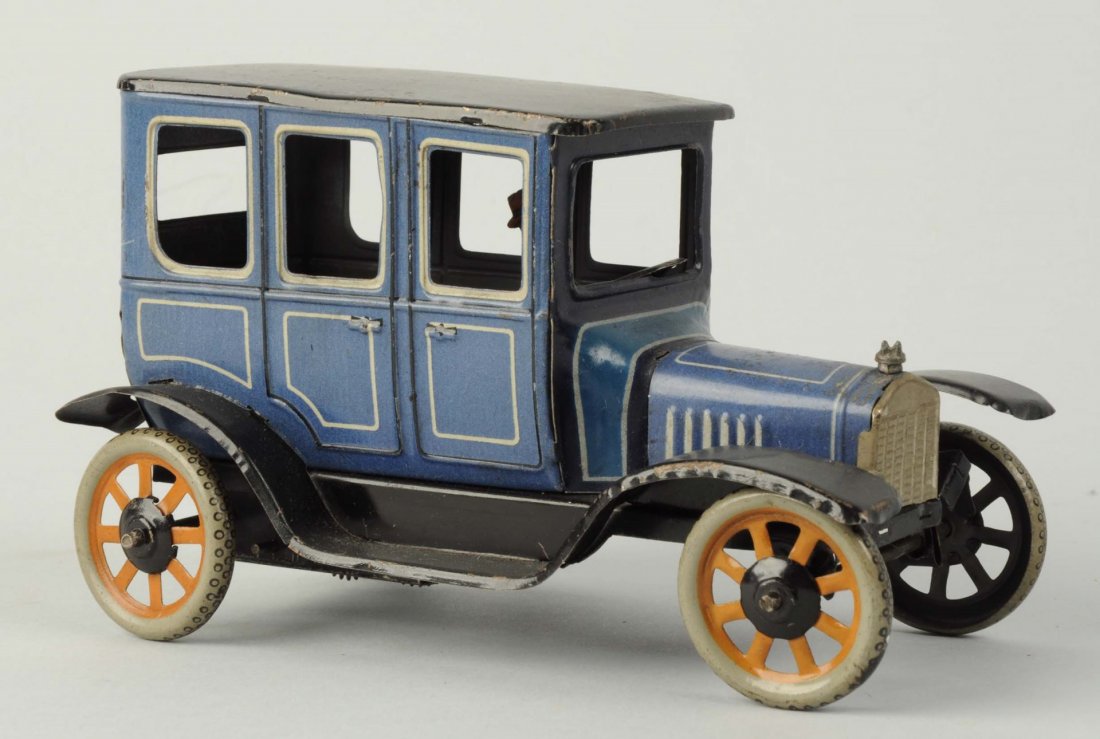 German Tin Litho Wind - Up Bing Automobile Toy.: Unusual blue color, male driver, marked "Germany" on rear of car and underneath of car. Minor scratching and wear but missing back spare tire and license plate. Condition (VEry Good). Size 6 - 1/4" L.