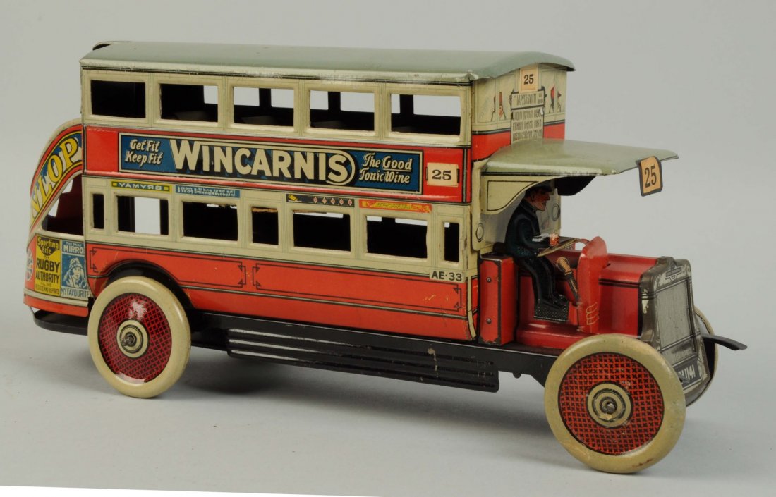 German Tin Litho Tippco London Bus.: Marked "Wincarnis" on one side and "Del Monte Canned Fruits" on the other side. Provenance Peter Ottenheimer collection, featured in his book "Toy Automobiles" on page 134. Very little wear. Original 