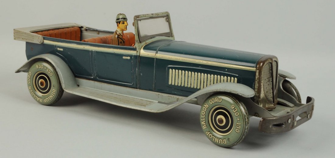 German Tin Litho Wind-Up Distler Open Touring Car: Nice original tin litho driver. Marked "Dunlop Balloon Cord" on tin litho tires. Some oxidation to bare metal parts including grille and windscreen. Some scratching and wear throughout, especially to 
