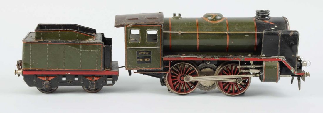 Marklin 0-4-0 Locomotive and Tender in 1 Gauge.: This locomotive is complete and all original, but has some scratches and paint chips. The tender is also complete and all original, very clean and attractive, has some scratches and paint chips, minor