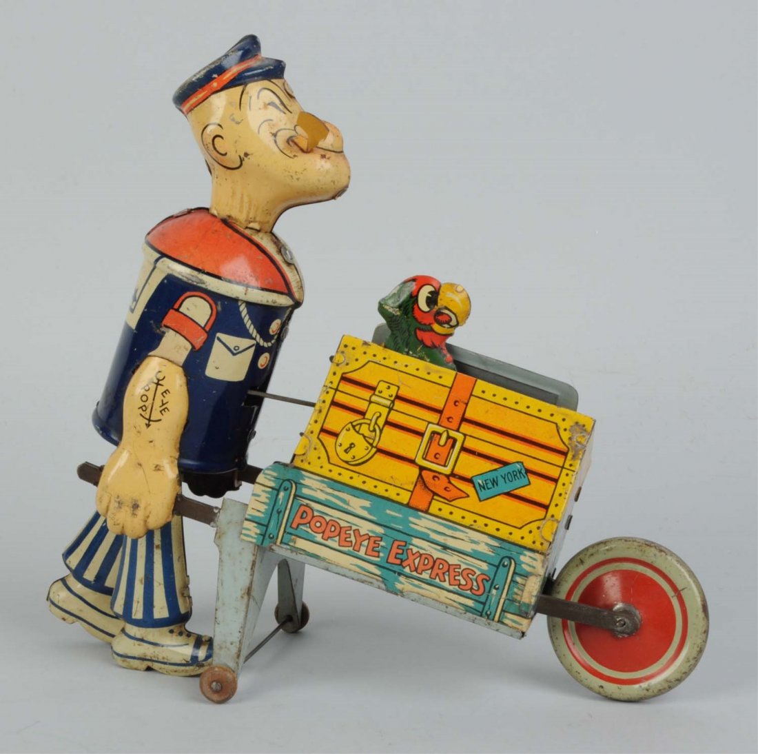 Marx Tin Litho Wind-Up Popeye Pushing Parrot Toy.: Scarcest version with moveable parrot. Original parrot door and pipe. Has some scratching and scuffing. Condition (Very Good). Size 8 -1/2" T.