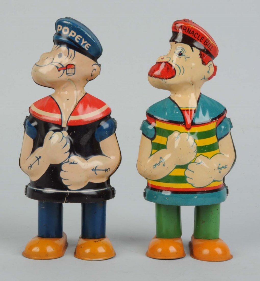 Lot Of 2: Chein Tin Litho Walking Toys.: One is Popeye marked "1932 King Features Syndicate" and the other is Barnacle Bill. Same mold but different litho. Better Popeye version with "Popeye" written on hat. Some slight scratching and wear a