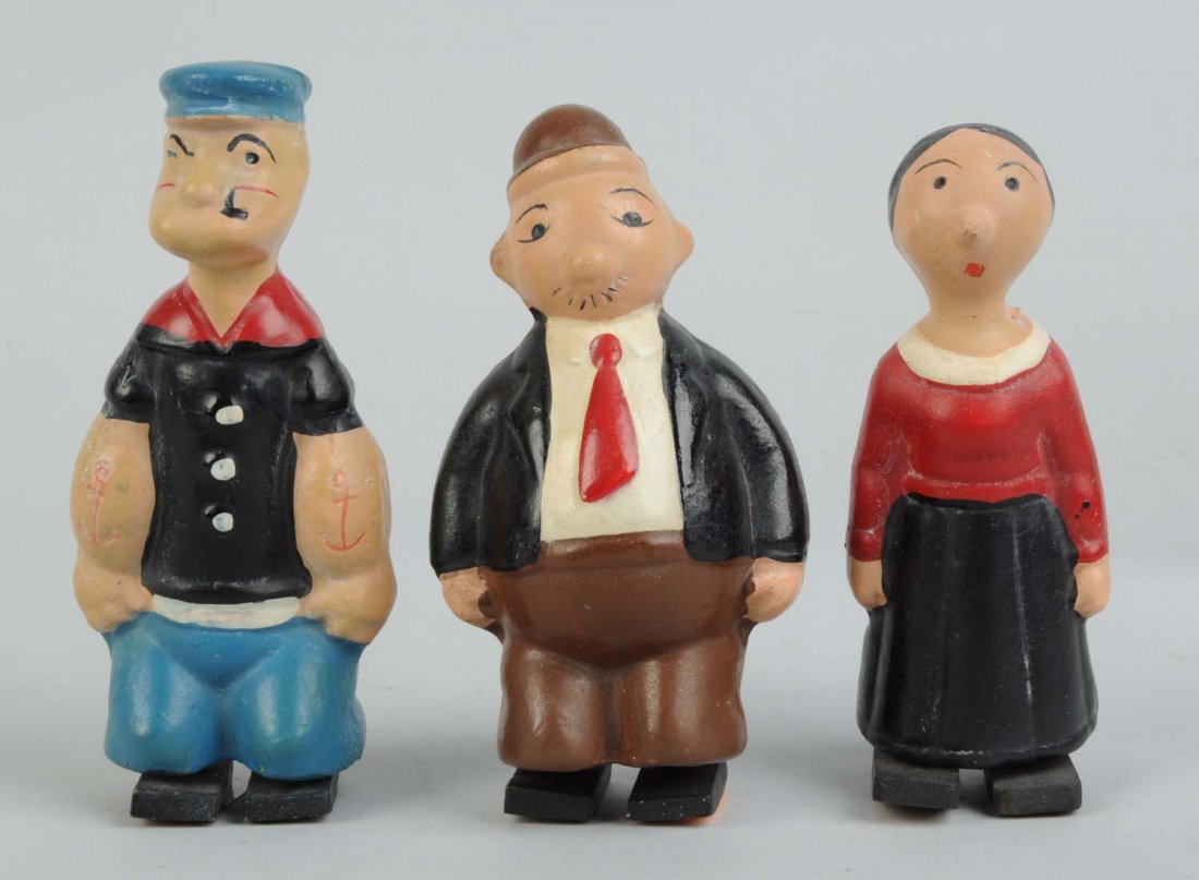 Lot Of 3: Comp. Popeye Thimble Theater Figures.: Includes Popeye, Olive Oyl, and Wimpy. Wimpy is marked on bottom "Copyright 1929 King Features Syndicate", as is Popeye. No markings on bottoms of Olive Oyl's feet. Some crazing. Condition (Very Good