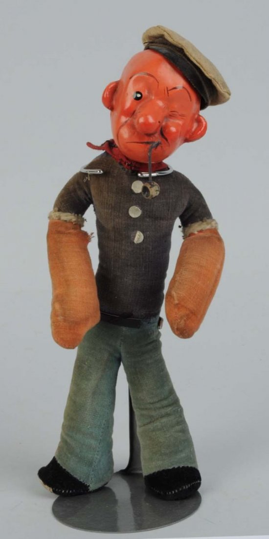 English Cloth Popeye Doll.: Origina hat and pipe, composition face. Tag on bottom reads "Copyright Popeye King Features Syndicate 1929 Dean's Rag Book Co. Made in England". Some fading and soiling. Condition (Very Good). Size 9 
