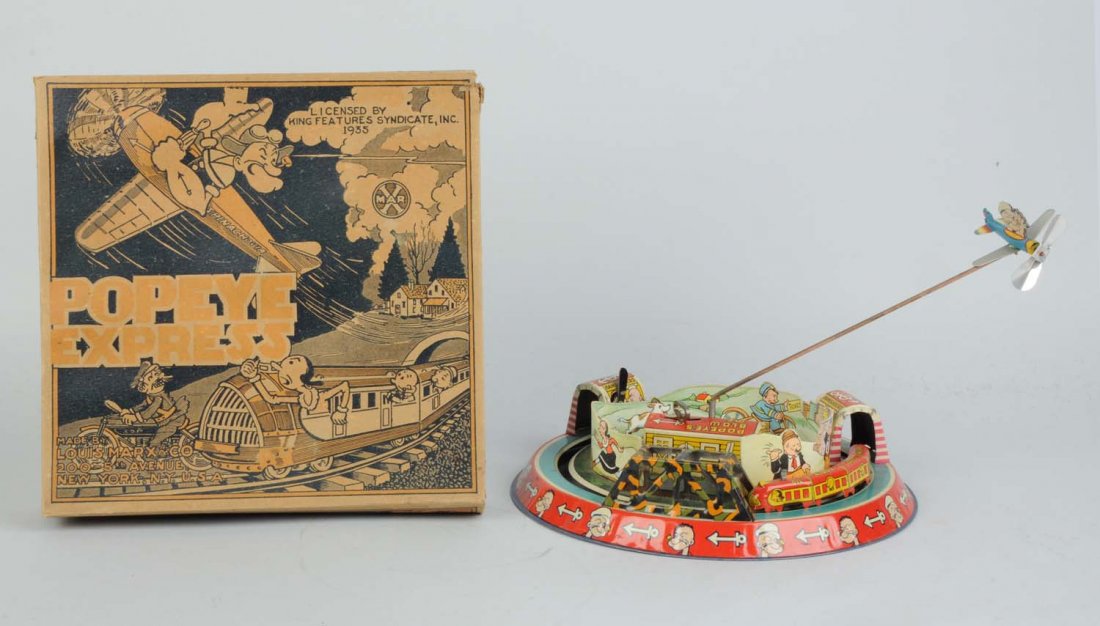 Marx Tin Litho Wind-Up Popeye Express.: With overhead airplane toy. Includes very colorful original box. Also has original colored graphic cardboard insert around inside of base. Propeller on plan is original. Box is marked "King Features S