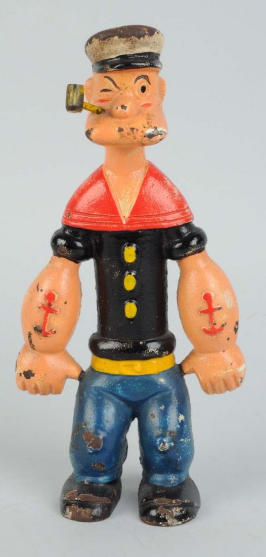 Hubley Cast Iron Popeye Doorstop.: Copyright dated "1929 King Features Syndicate". Looks to be original pipe. Some paint loss and wear to hat, chipping to chin and knees. Nice solid original piece. Condition (Very Good - Excellent). Si