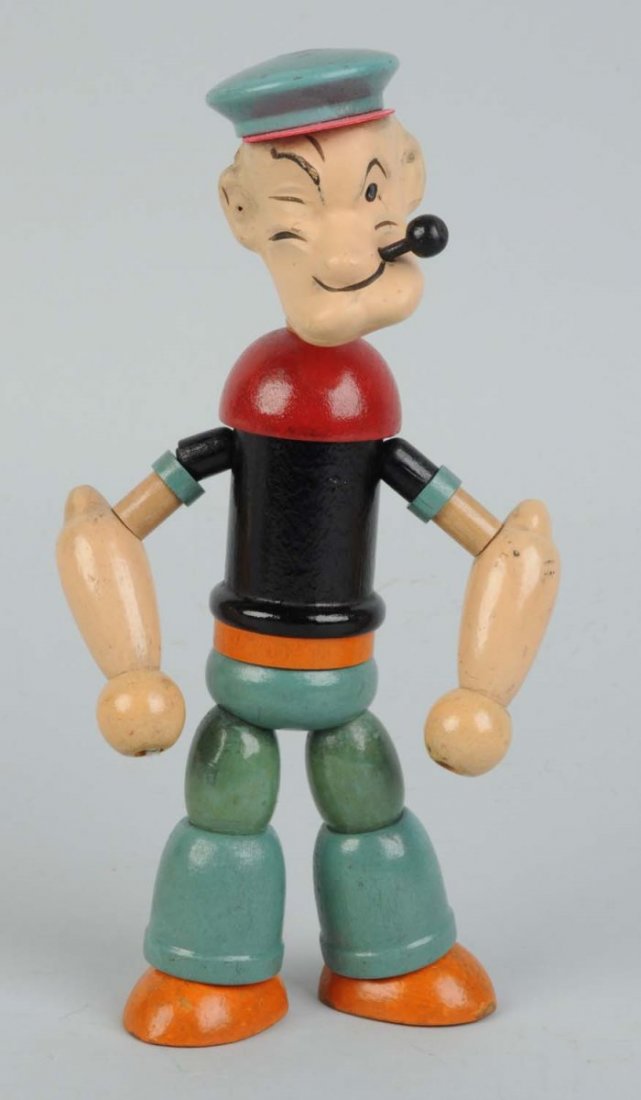 Popeye Wood-Jointed Doll.: Composition head. Circa 1935. Original celluloid hat brim. Marked "Made in USA" on bottom of right foot. Appears to be original pipe. Some crazing to face. Condition (Very Good - Excellent). Size 8" T