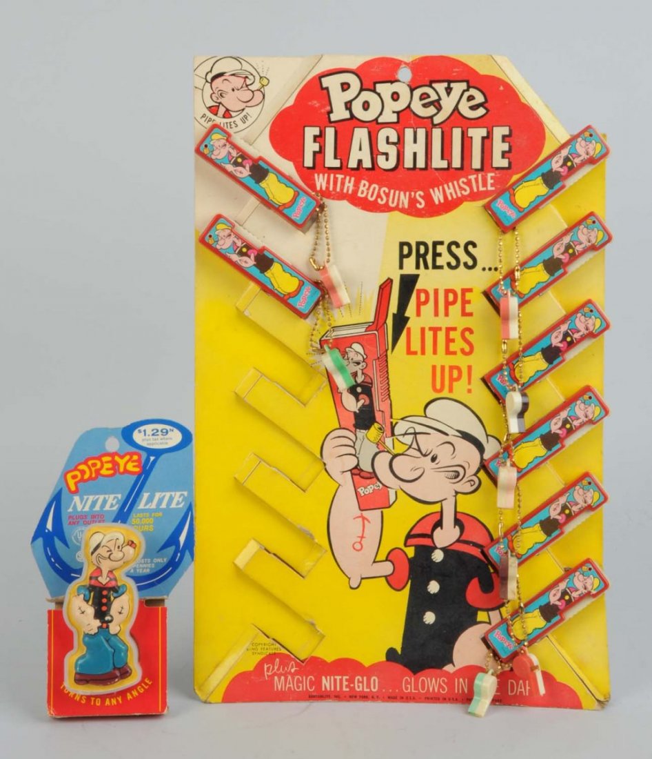 Lot Of Popeye Flashlights & Night Light.: Lot includes one night light on original card. Made by Arrow Plastic Co.. And also a Popeye flashlight store display with eight of the initial 12 flashlights. Flashlights have a key chain holding a sm