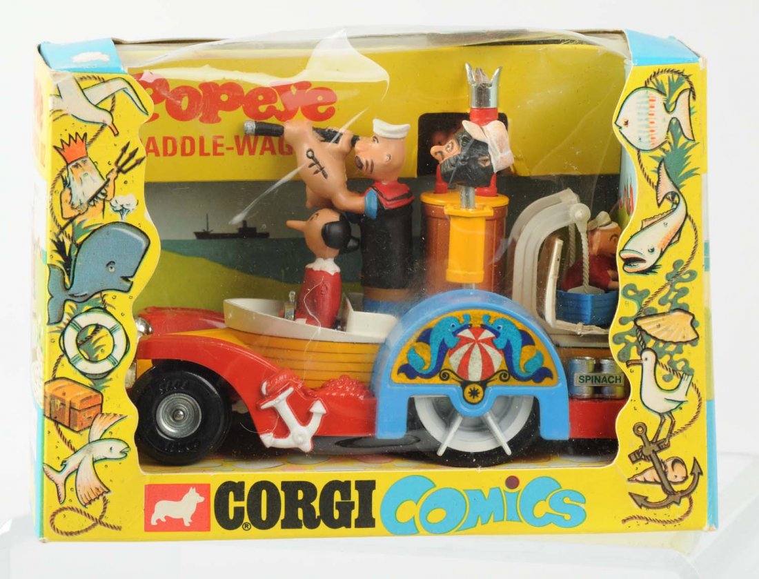 Corgi Diecast Popeye Paddle-Wagon.: Includes very colorful original box. Box is marked "King Features Syndicate, Inc. 1967" and has some paper loss to back. Bubble is pushed in slight on front but not cracked. Toy looks unused. Conditio
