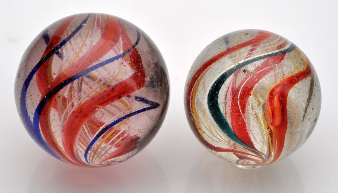 Lot Of 2: Large Swirl Marbles.: The smaller is a multicolor divided core. (this marble has two surface fractures). The larger is a three stage ribbon latticino core. Core is made up with three ribbon of yellow and white latticino. S