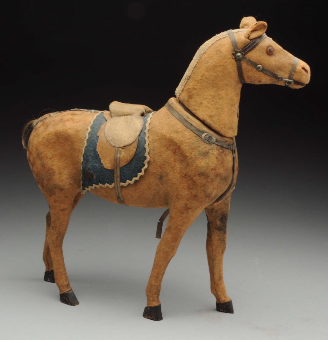 Horse Candy Container.: Felt covered with wood legs, glass eyes, very nice detail to bridle fittings (one hoof damaged, no tail, wear to saddle blanket). Wonderful accessory for a boy doll! Condition (Very Good). Size 12" L.