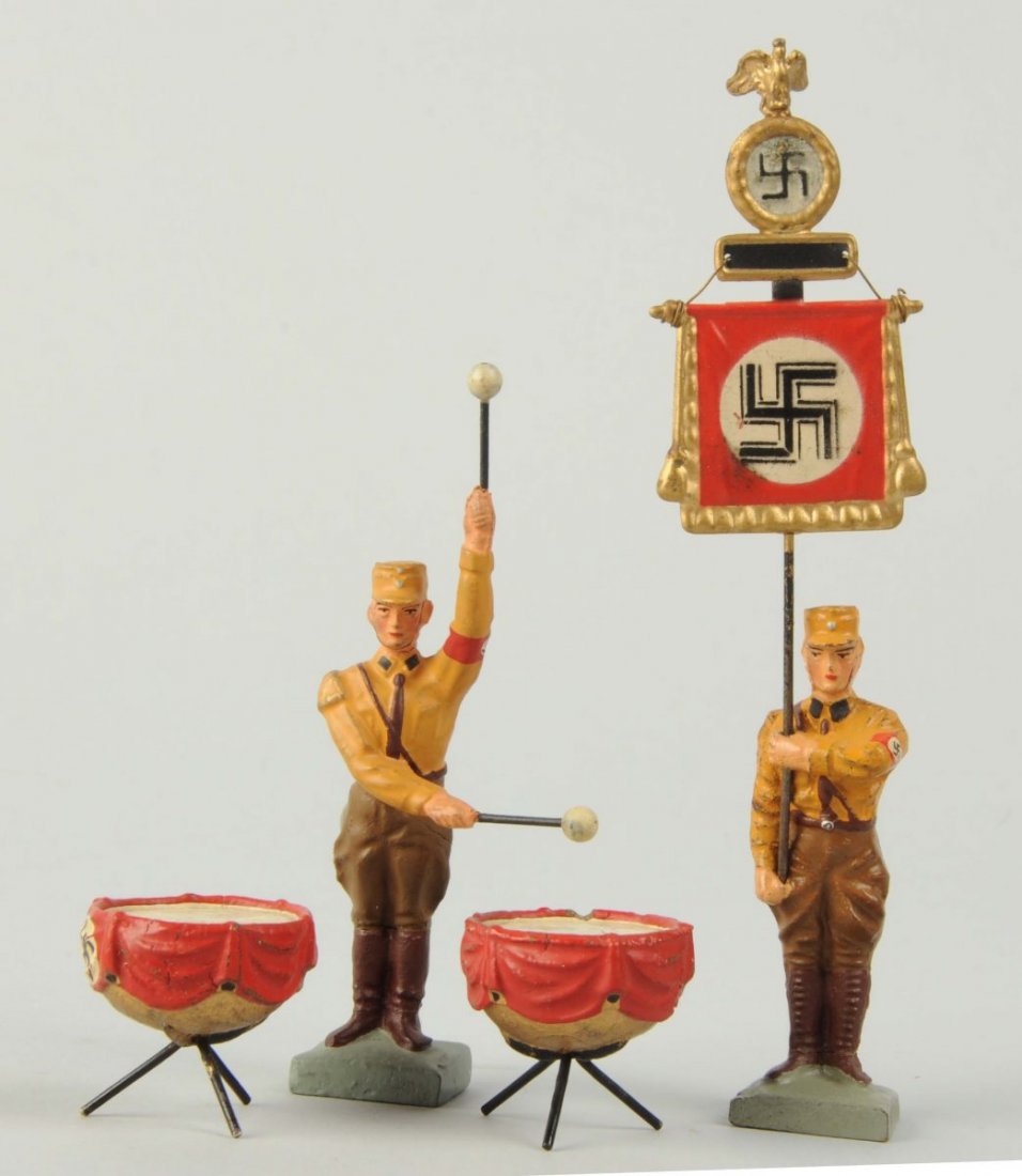 Lot Of 4: Lineol 7dm SA Standing Figures.: Lot includes: banner carrier and standing kettle drummer. Condition (Excellent).
