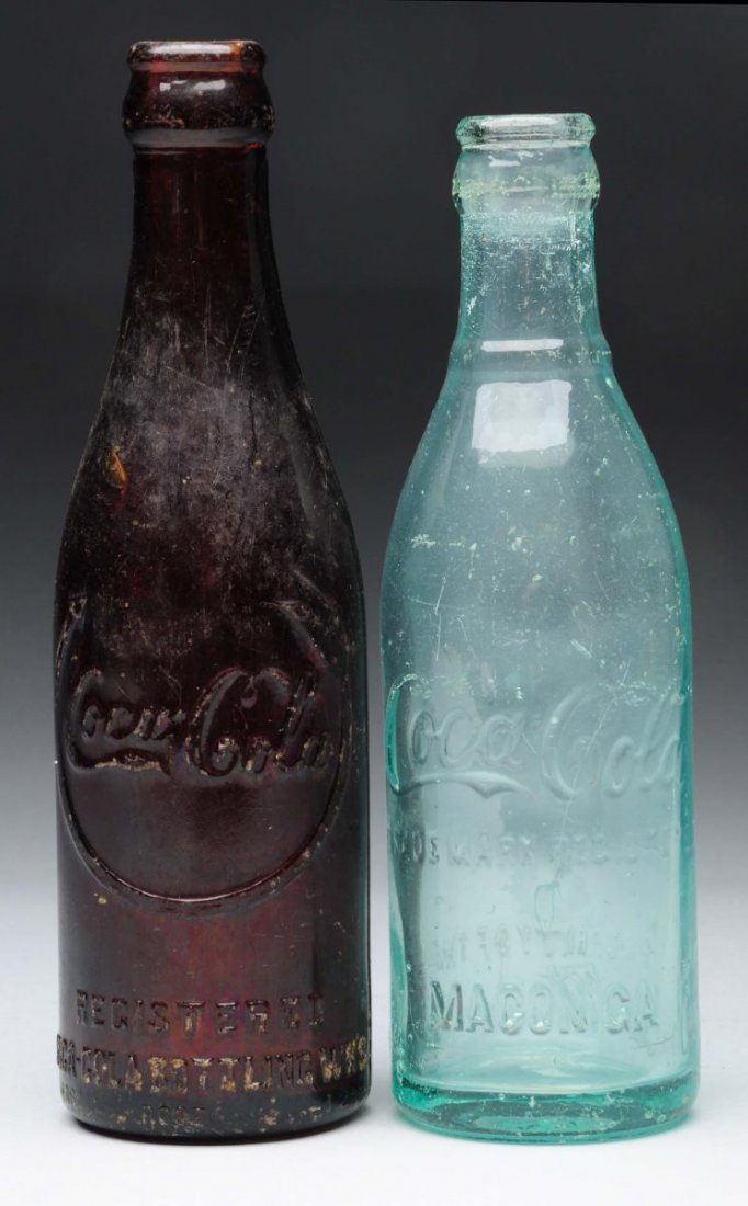 Lot Of 2: Early Coca - Cola Glass Bottles.: One is from Macon, Ga and the other is from Jackson, Tn. Both bottle have scrapes and some chipping. Condition (Good). Size Largest : 8" T.