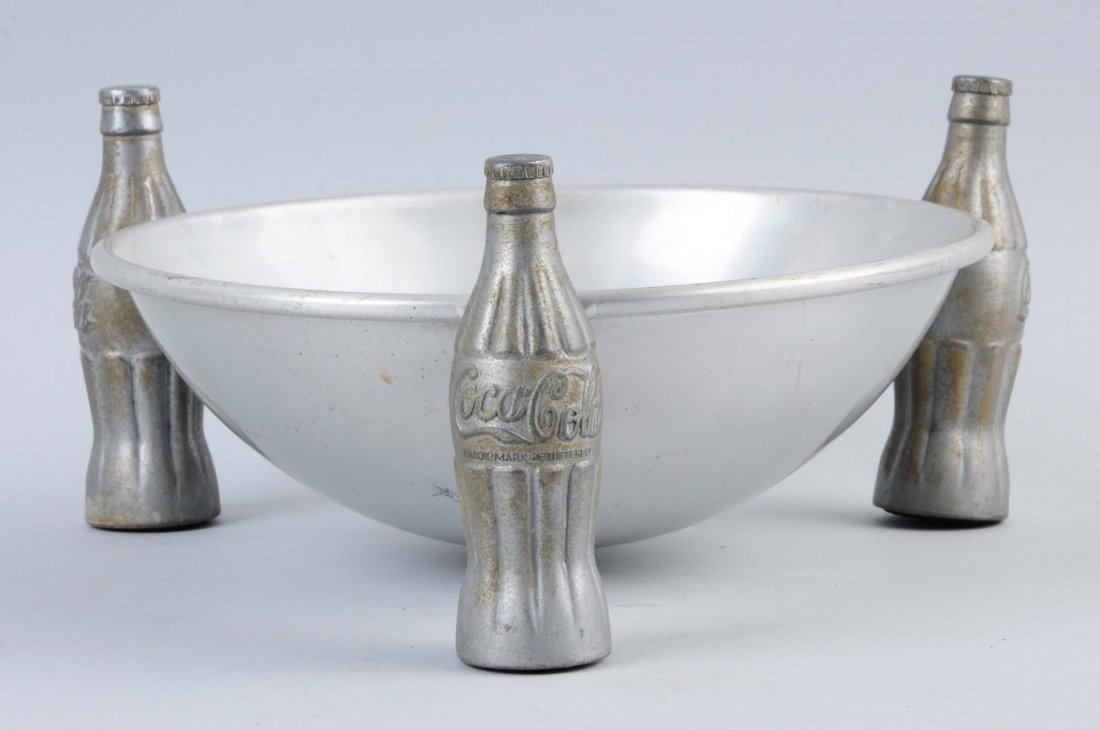 1930s Metal And Aluminum Coca-Cola Pretzel Bowl.: Some shallow dents in the bowl and some uniform oxidation to the coke bottles. Condition (Good - Very Good). Size 9" L.