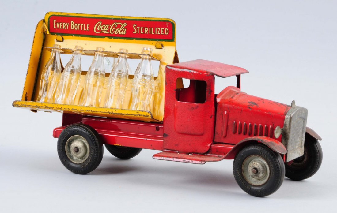 1932 Coca - Cola Metalcraft Truck.: Moderate wear and scratching on truck. Missing three glass coke bottles. Decal loss on the back of truck. Condition (Good). Size 10 -1/2" L.