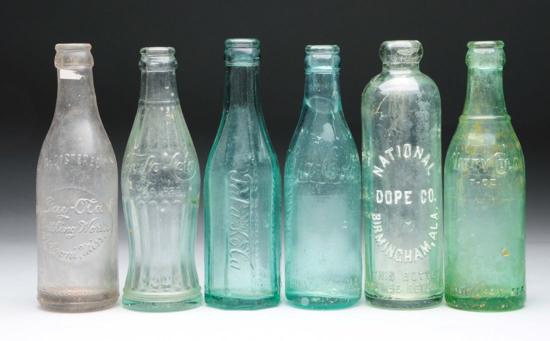 Lot Of 6: Assorted Glass Soda Bottles.: Great lot of six obscure soda bottles including Ala Cola, Taka Cola, Gay-ola, Nifty Cola, Foslo Cola and the national dope co. All bottles exhibit some scratches and mild to heavier wear. Condition (F