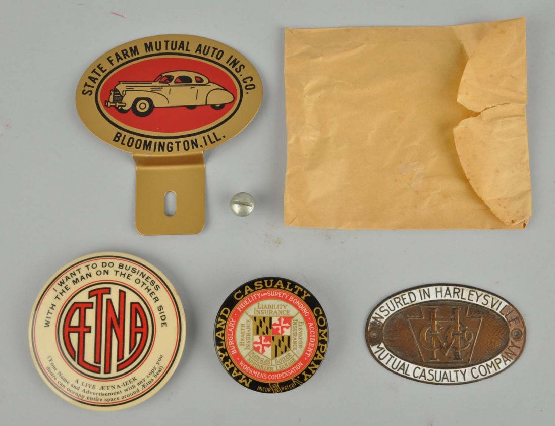 Lot of 4: Insurance Advertising Items.: This lot includes a State Farm license topper, an Aetna mirror, a Maryland Casualty Company mirror and other items. Condition (Very Good Plus). Size Largest : 5 -1/2"L.