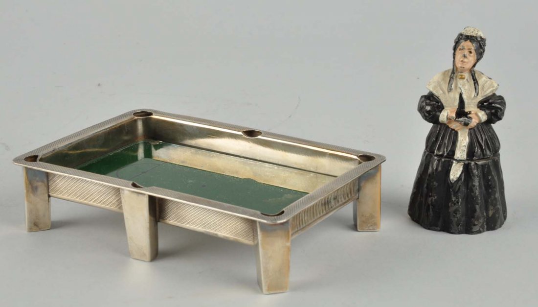 Lot of 2: Match Safes.: This lot includes a match safe in the form of a woman and another shaped like a pool table. Minor paint loss to the woman. Condition (Very Good Plus). Size Largest : 6" L.