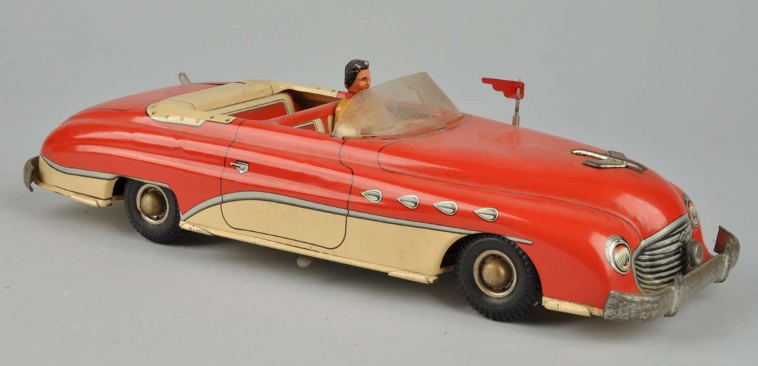 Tin Battery-Operated Convertible.: The car has slight scratches to the tin mainly toward the bottom. Appears to be original paint. The bumpers and front logo of the car are made of chrome and has light oxidation on them. The battery co