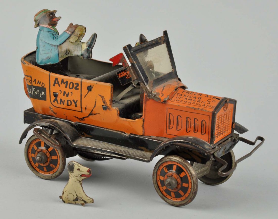Marx Tin Litho Wind-Up Amos & Andy Car.: Made in the U.S. Car has scratching, wear, paint loss, and oxidation throughout. Car includes its original key, tin driver, passenger, and dog. Dog is detached from the car. Condition (Good - Very Goo
