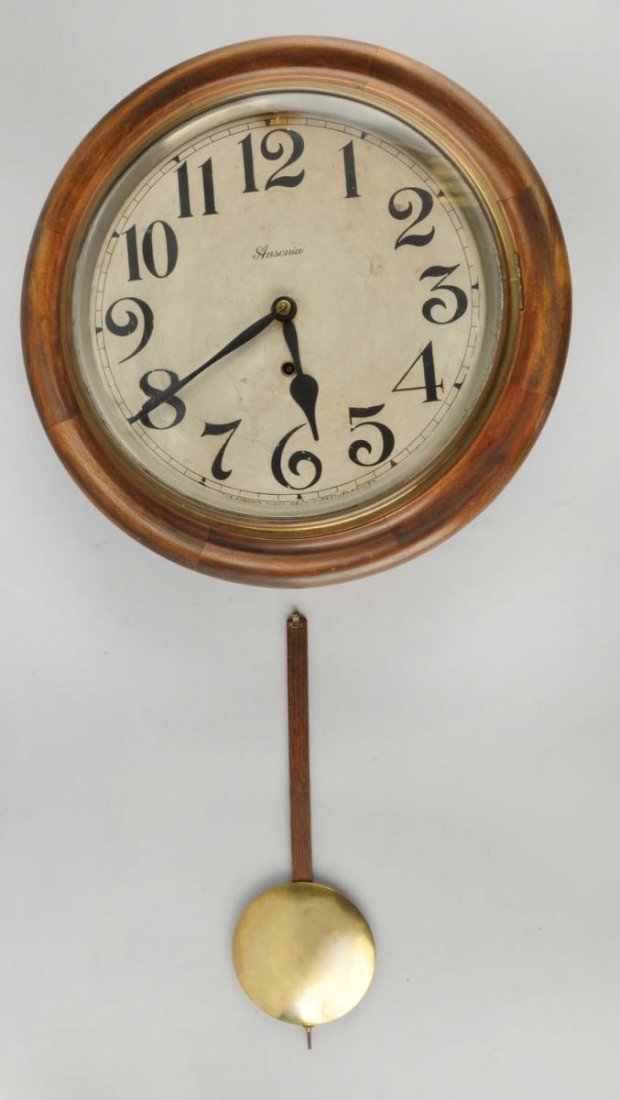 Wooden Ansonia Hanging Wall Clock.: This Ansonia clock has minor wear to the face. No key. Condition (Very Good Plus). Size 16" Dia.