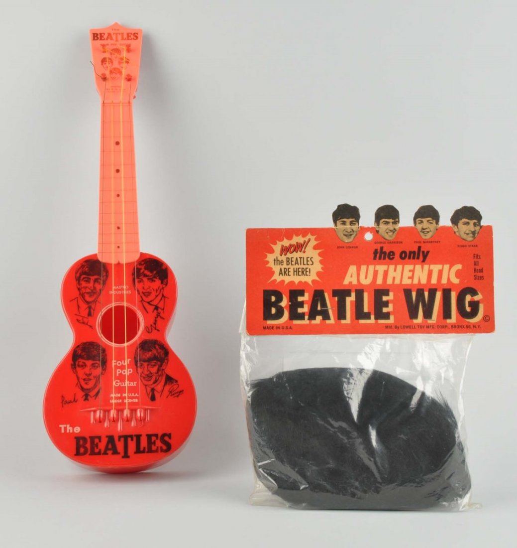 Beatles Toy Guitar And Wig.: This lot includes a Beatles Four Pop Guitar and a Beatles Wig in original package. The guitar has only the most minor wear. The wig is unused. Condition (Excellent). Size Largest : 21 - 1/4" T.