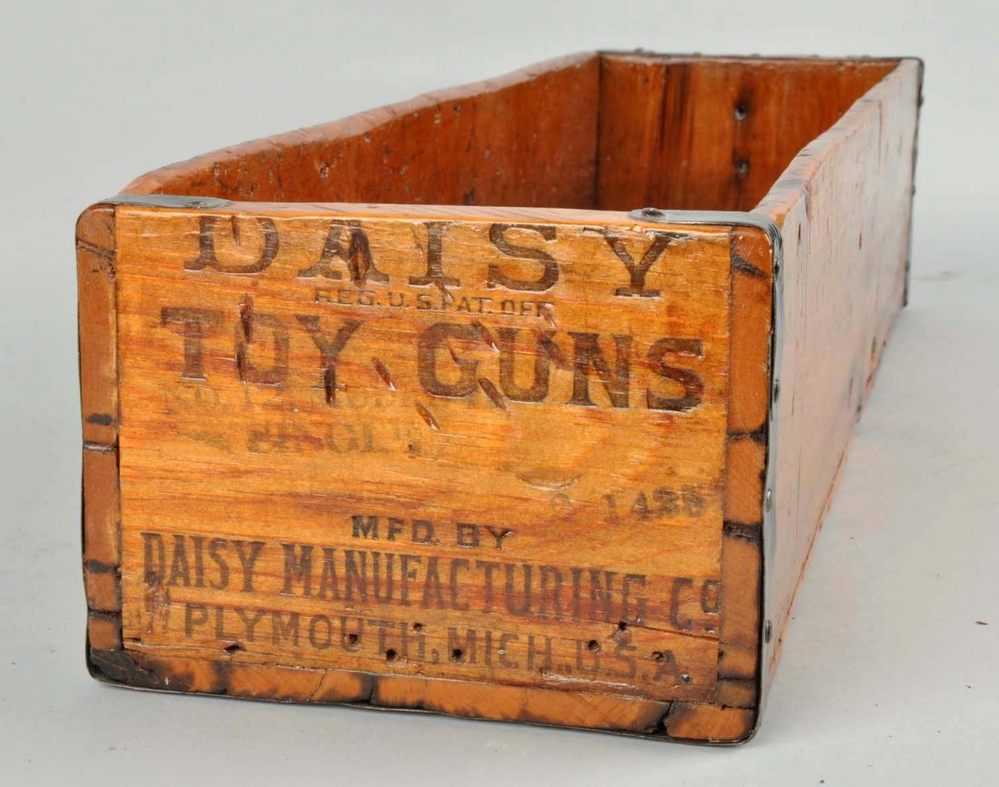 Daisy BB Gun Wooden Shipping Crate.: This crate has a coat of varnish applied. No lid. Minor wear. Condition (Very Good Plus). Size 26" L. x 5" T. x 7" D.