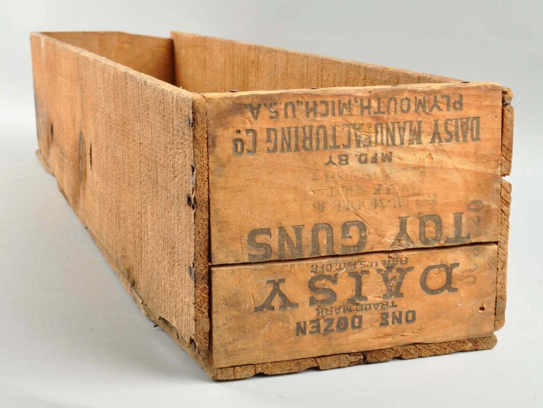 Daisy BB Gun Wooden Shipping Crate.: This crate has moderate overall wear. Lid is included but has quite a bit of black writing on it. The box originally held one dozen Model 36 BB guns. Condition (Very Good). Size 34" L. x 6" T. x 7 - 1