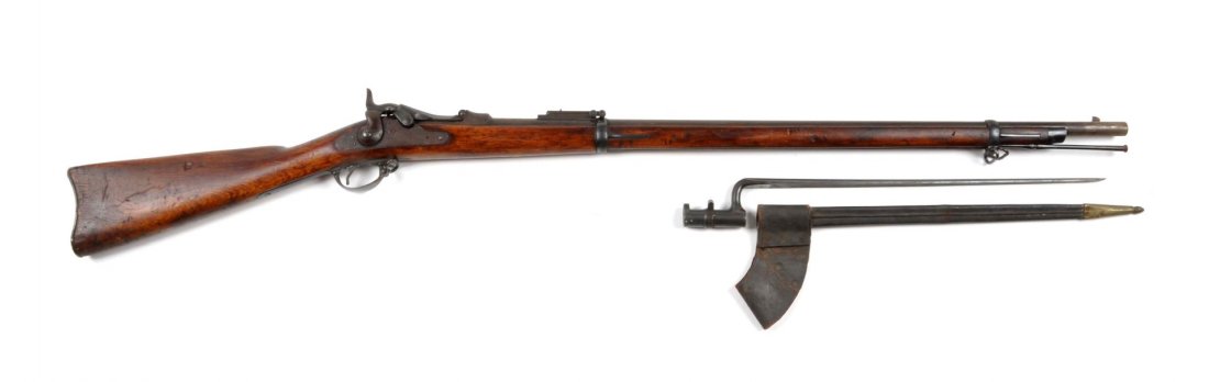U.S. Springfield Model 1884 Trapdoor Rifle.: Serial # 321542 Caliber .45-70 with a 32-5/8" barrel, blued finish, walnut stock and case colored breach block and tang. All metal is basically a blue-brown patina with some freckling. Walnut stocks a
