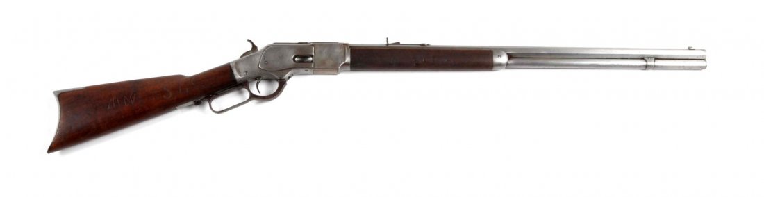 **Winchester Model 1873 Lever Action Rifle.: Serial # 317955B This rifle was manufactured in 1899. It is chambered for the 38-40 cartridge. This is a standard rifles that features a 24" barrel, full magazine, sporting sites, walnut stock, cresce