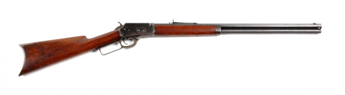 Fine Marlin Model 1889 Lever Action Rifle.: Serial # 74023 This is a standard sporting rifle chambered for the 38-40 cartridge. It features a 24" octagon barrel, full magazine, blued finish, varnished walnut stocks, crescent steel blutt plate a