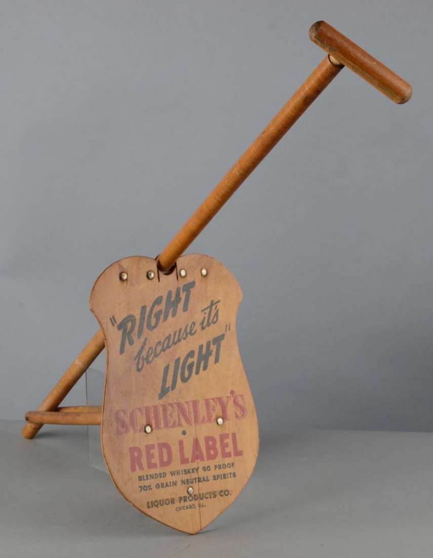 Schenley's Red Label Whiskey Cane Seat: Walking cane unfolds into a stool and the seat is printed, "Right because it's light Schenley's Red Label Whiskey." Condition (Excellent). Size 34-1/2" T.