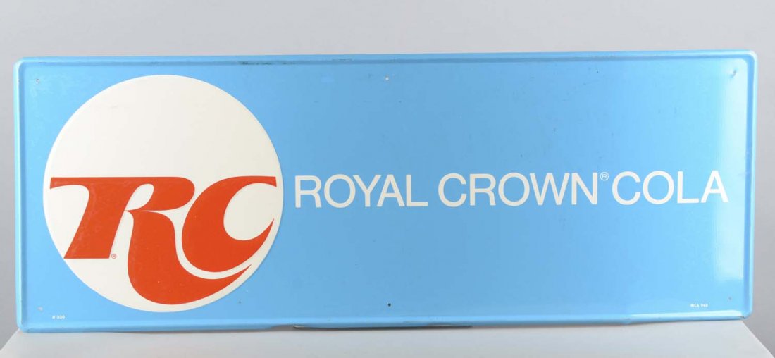 RC Royal Crown Cola Self-Framed Tin Sign: This sky blue tin sign reads, "RC Royal Crown Cola". There is small manufacturing printing that reads, "#520, MCA 948". The sign is slightly bent. Condition (Good). Size 11-3/4" x 32"