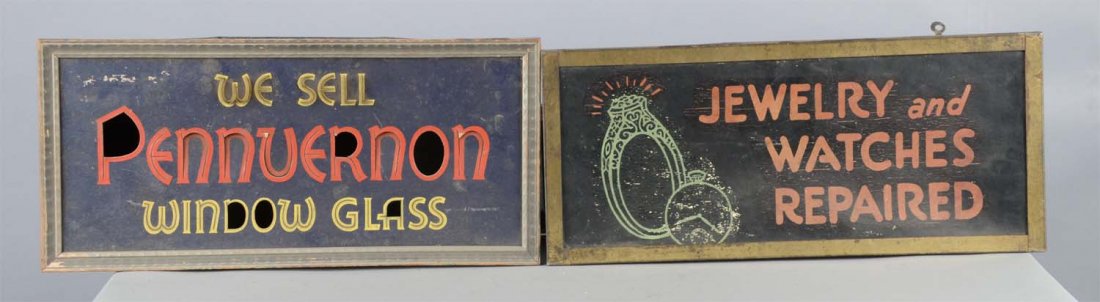 Lot Of 2: Lighted Masonite Advertising Signs: Including 1 - Escolite Displays Inc. "We Sell Pennuernon window glass" sign without lighting mechanism and 1 - "Jewelry and watches repaired" sign with watch and ring graphic. Condition (Fair - Good).