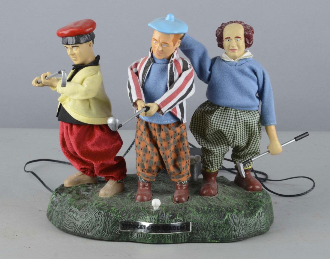 Three Stooges Golf Academy Automaton: This battery operated electric display moves at the press of the teed up golf ball. Very faint sound bites can be heard and may become louder with a new set of batteries. Made by Global Icons LLC circ