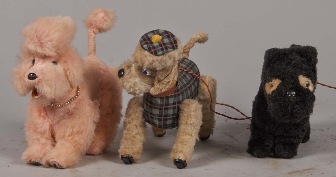 Lot Of 3: Alps Wind-Up Toy Dogs: Including a pink poodle, a Scottie, and a terrier with dog bone shaped winding key. Made in Japan. Each sheds just slightly. Condition (Fair). Size Each approximately 6" x 8" x 4"