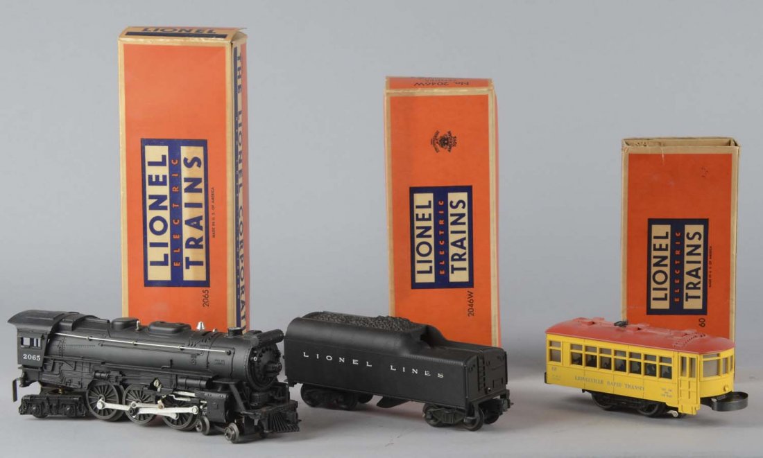 Lot Of 3: 2065 Locomotive, 6046W, 60 Lionel Trains: All three items come in the original boxes, including 1 - # 2065 Locomotive with smoke chamber, 1 - # 2046w tender with whistle, and 1 - # 60 Trolley. Boxes have varying degrees of wear. Circa 1950s C