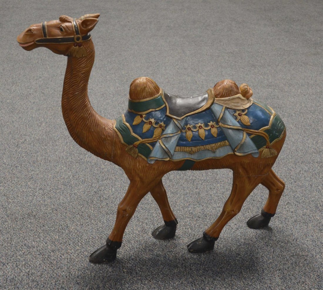 Carved Wood Camel: This is a colorful, detailed carving of a camel. Missing (possibly rope) tail. Came from a movie prop house, uses included "Postal". Condition (Very Good). Size 43" x 10" x 40"